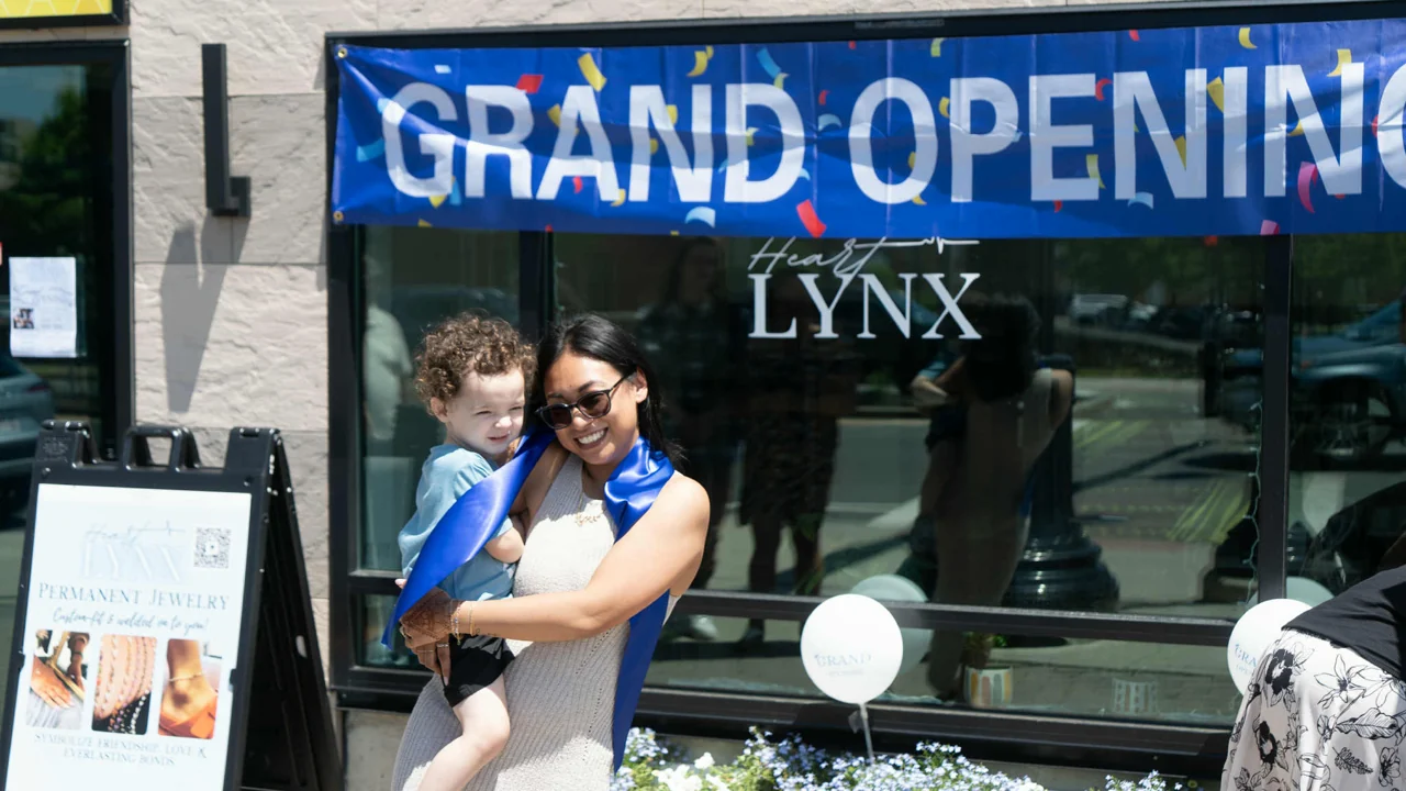 Manirichana and her son at the Heart Lynx storefront grand opening